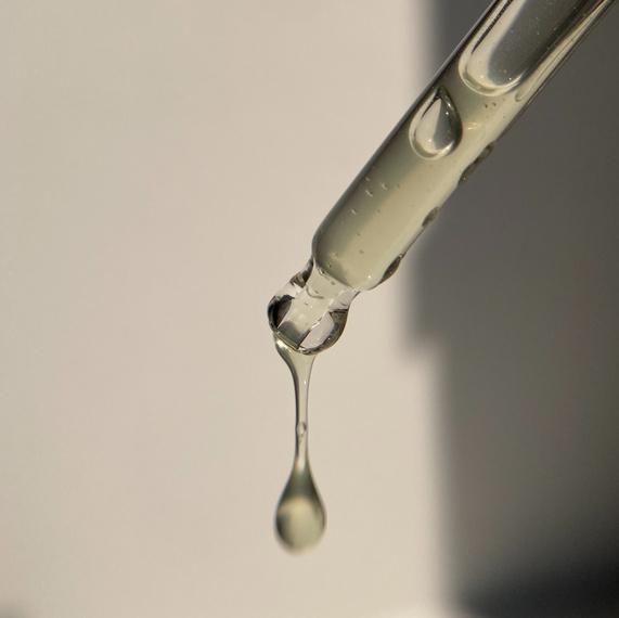 Serum drop falls from a pipette